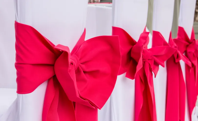 Pink Fuchsia chair sashes and bows with Arctic White stretch chair covers
