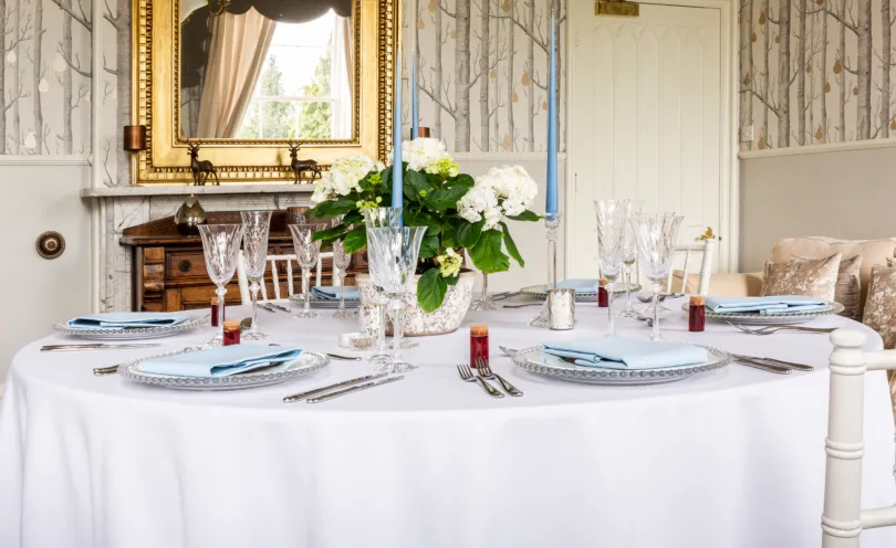 Cambridge Blue table linen napkins on a round Arctic White table cloth