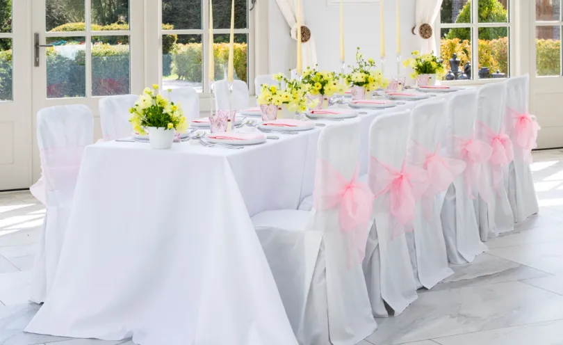 Arctic White label cloths and chair covers are ideal as a base to any table setting