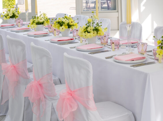 Blossom Pink napkins and organzas with Arctic White table cloths and chair covers