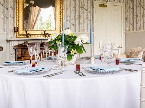 Cambridge Blue napkins on a round Arctic White table cloth