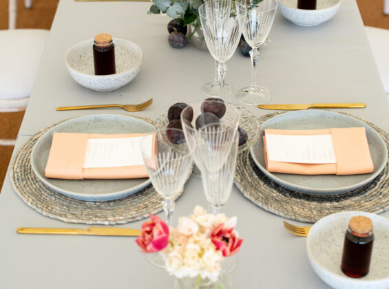 Coral napkins with Pebble Grey table cloths