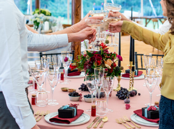 Glasses toasting with Merlot Red napkins