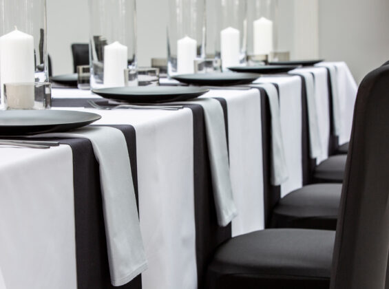 Pebble Grey napkins with Jet Black table runners and Arctic White table cloths