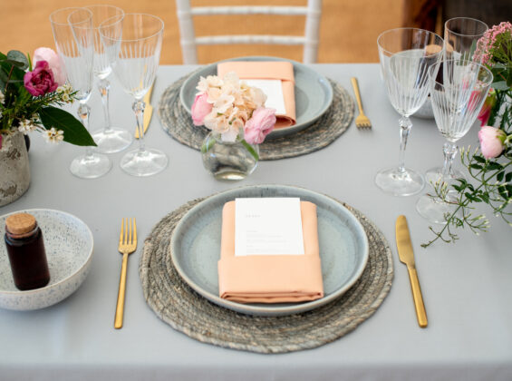 Coral napkins on a Pebble Grey table cloth