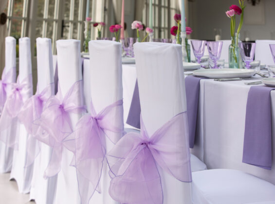 Summer Lavender napkins and organza sashes with Arctic White stretch chair covers and table cloths