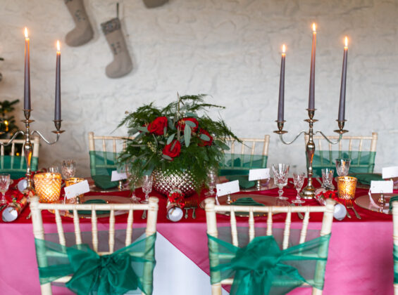 Arctic White with Red Poppy crystal organza topped with Forest Green Napkins and organza Chair Sashes