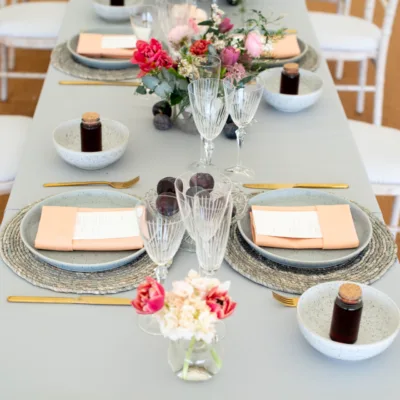 Pebble Grey table cloths with Coral napkins